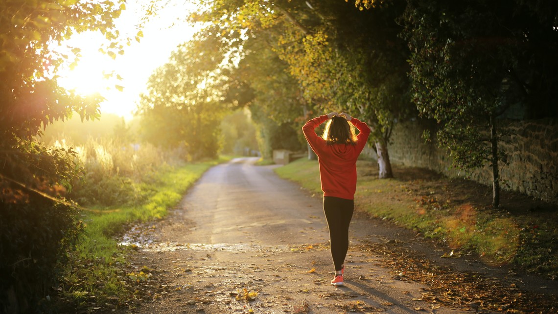 Stressed out woman walking on dirt road