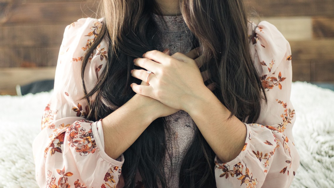 Image: lady with hands on her heart